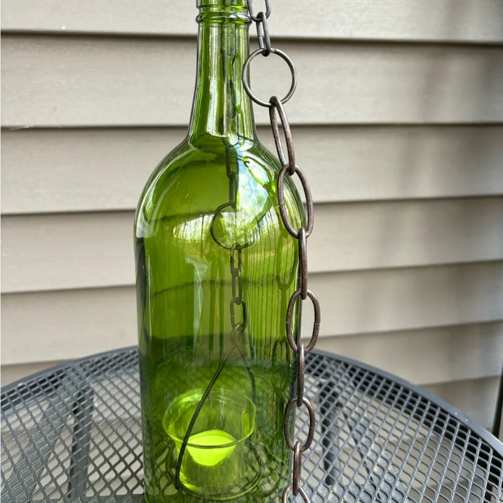 Hanging wine bottle with candle